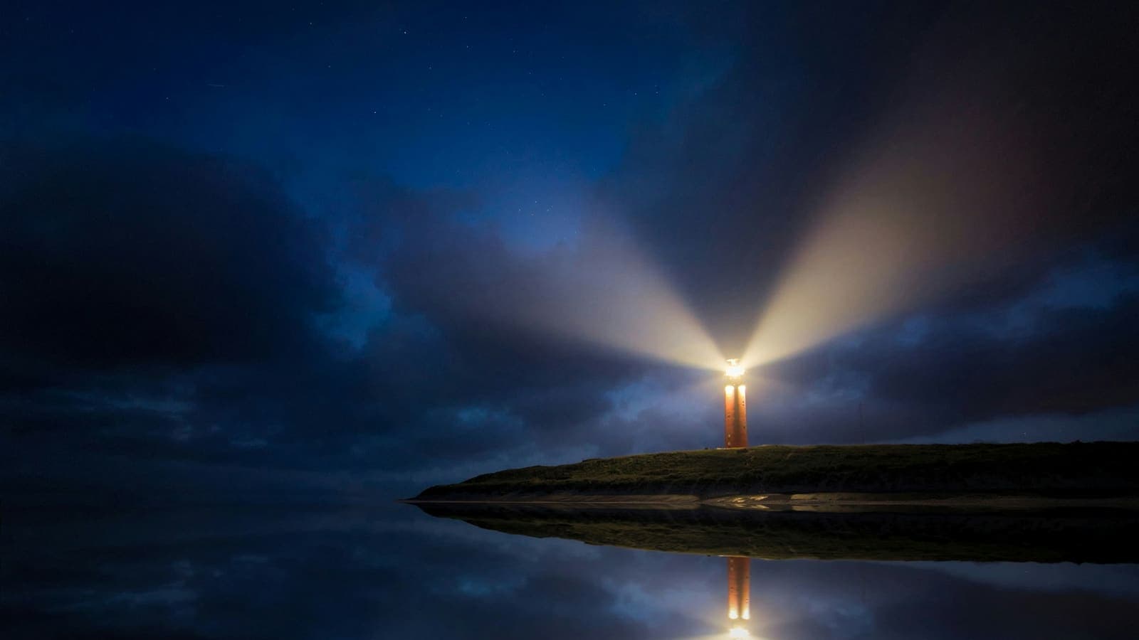 A lighthouse beam cutting through the night over the sea — signalling to clients who haven't heard of you yet