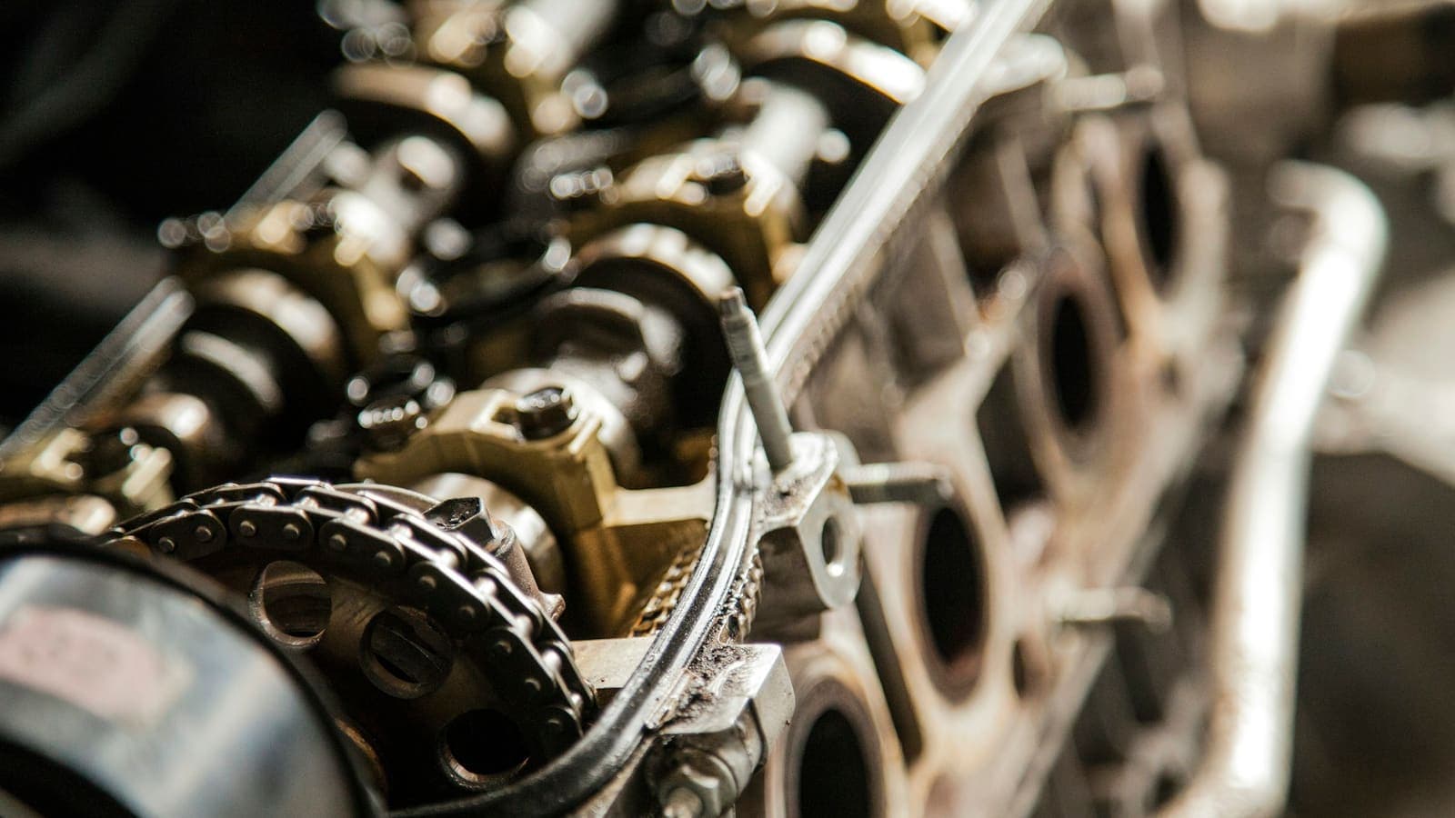 Close-up of a car engine bay — one engine, many parts working together