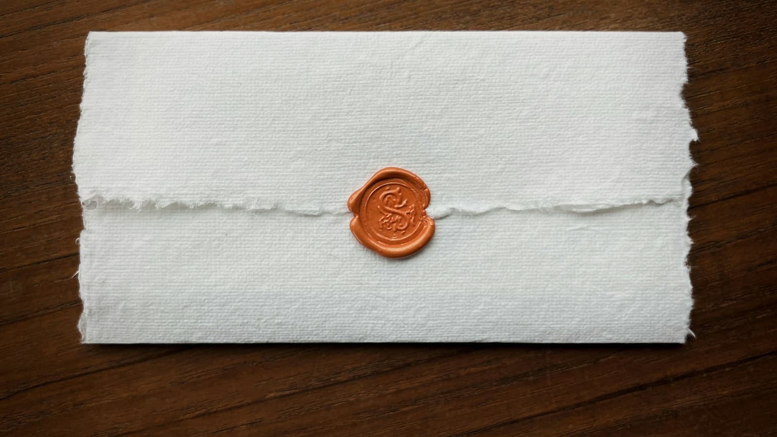 A wax seal pressed onto a sheet of paper
