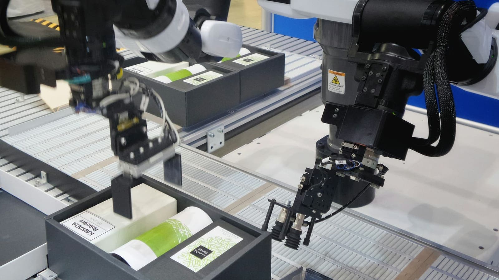 A black-and-white industrial machine on a factory floor — repeatable output by design