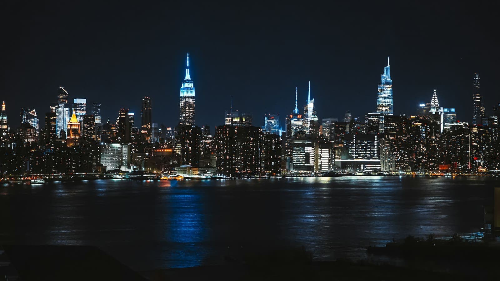 City skyline lit up at night — a business district running on systems, not luck